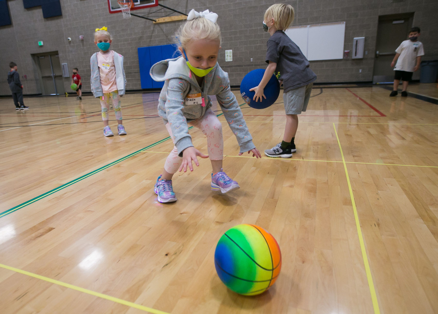 Kindergarteners participate in physical education indoors in Naches